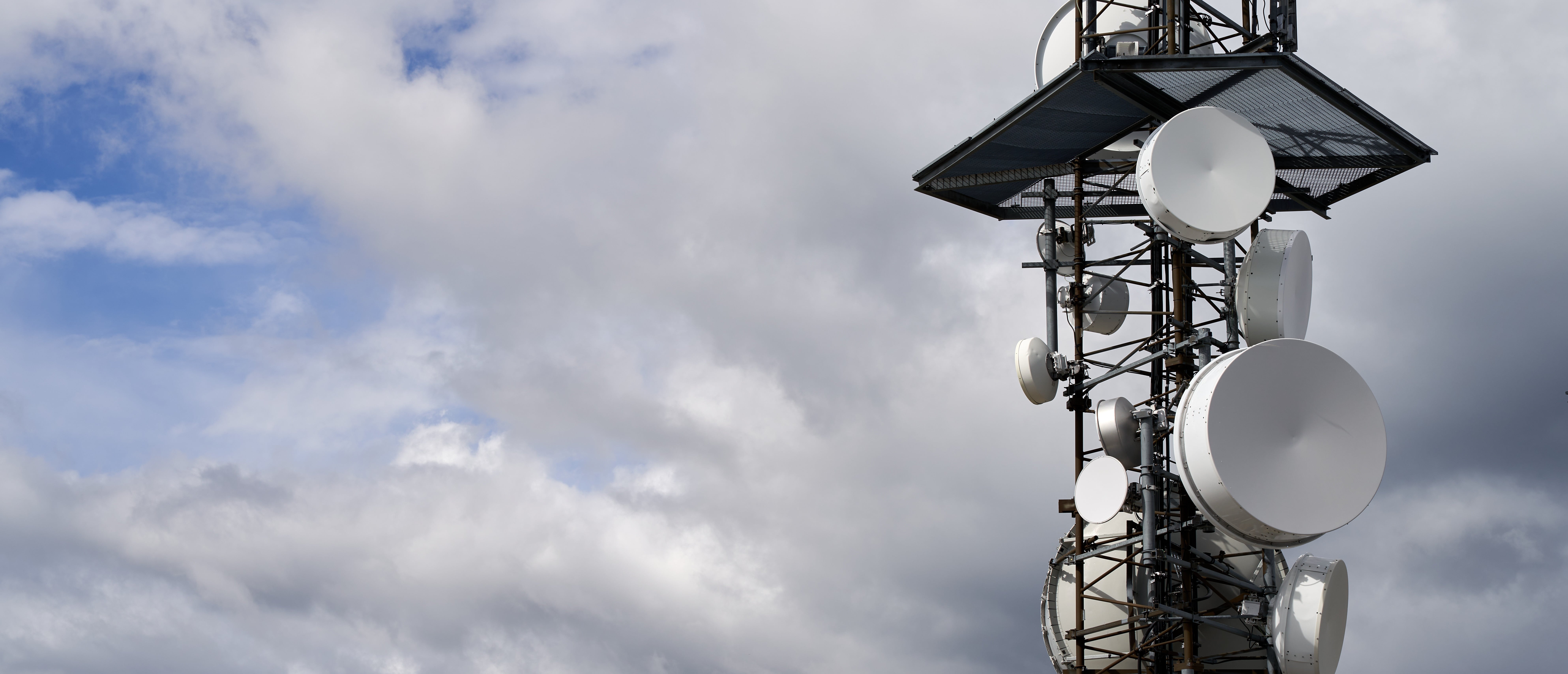 telecommunications-towers-against-cloudy-sky-min